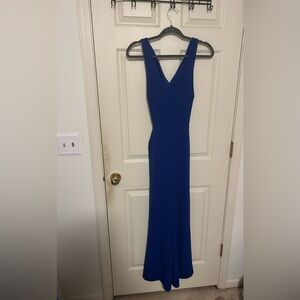 Size M Pant suit romper with pockets and open back